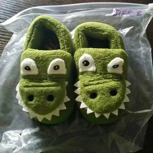 Toddler size 8..green croc slippers .hypoallergenic..